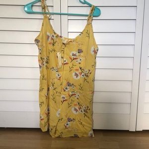 Yellow jumpsuit with flowers and adjustable back